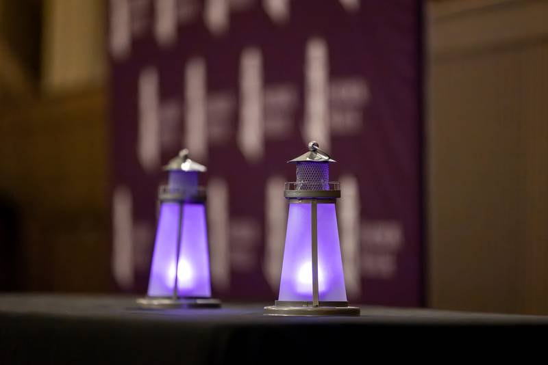 Two lighthouses glow purple to honor the lives lost in the community to domestic violence during Harbor House of Kankakee County's 5th annual Candlelight Vigil at the Knights of Columbus on Oct. 26, 2023.