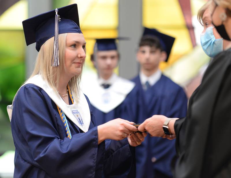 Nazareth class of 2022 students including Tara Noonan of Franklin Park receive their diplomas during their graduation ceremony Sunday May 22, 2022.