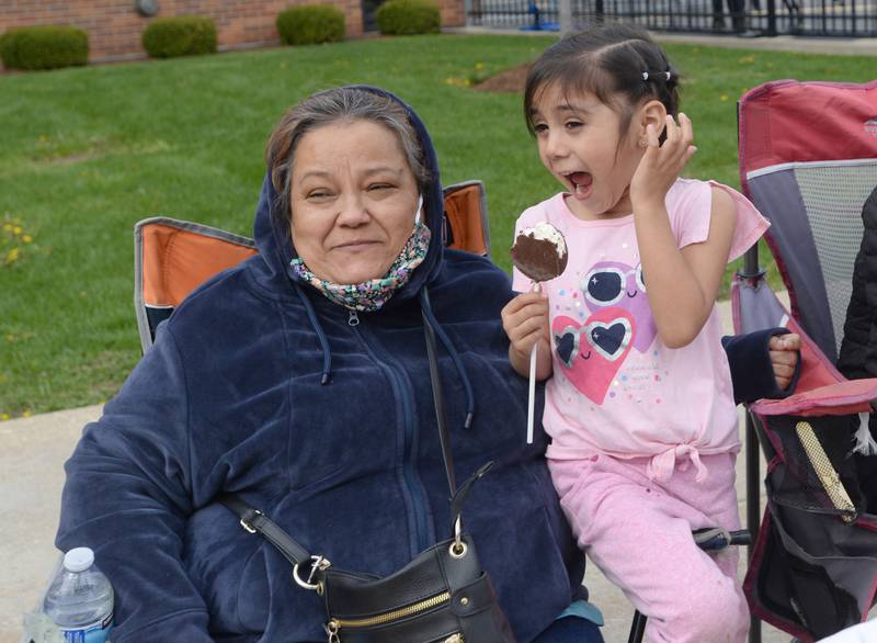 Janine Rodriguez of Berwyn reacts to the loud sirens beside Maria Vasquez during District 98's Dia de los Niños parade held Friday April 29, 2022.