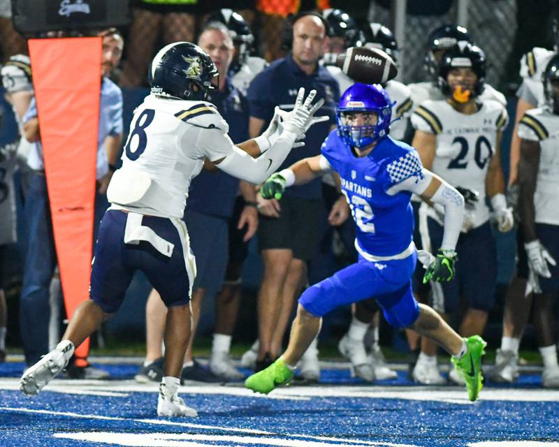 IC Catholic Prep's Tamarion Garner (8) catches the ball during the game on Friday Oct. 3, 2025, while traveling to take on St. Francis High School.