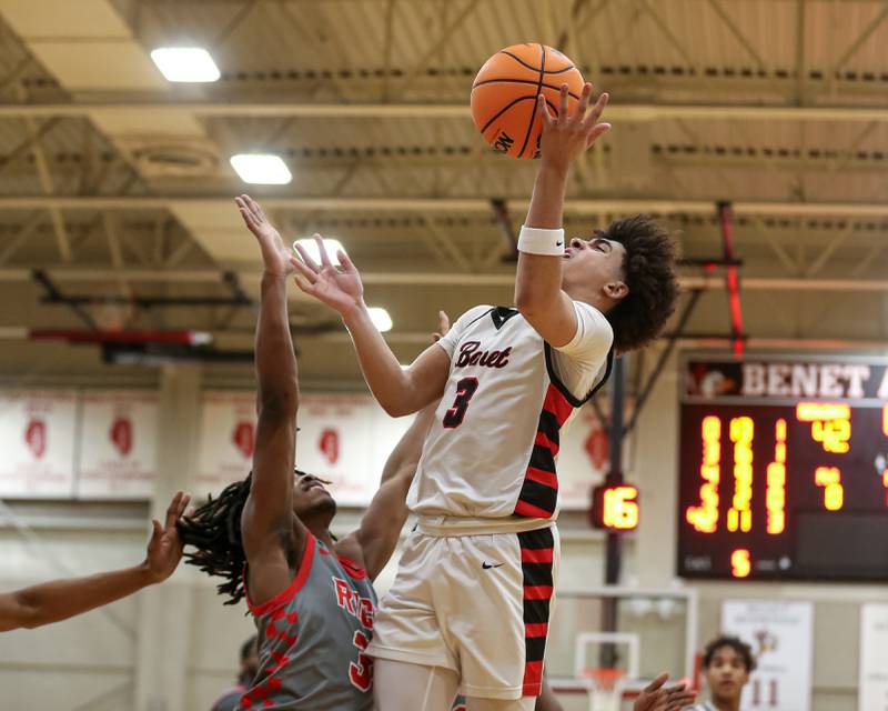 Benet's Jayden Wright (3) is fouled on a made basket during their When Sides Collide Shootout basketball tournament matchup between Rich Township at Benet Academy. Jan 25, 2025 in Lisle.