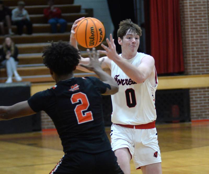 Forreston's Brendan Greenfield (0) looks to pass against Milledgeville on Wednesday, Dec. 18, 2024 at the 63rd Annual Forreston Holiday Tournament.
