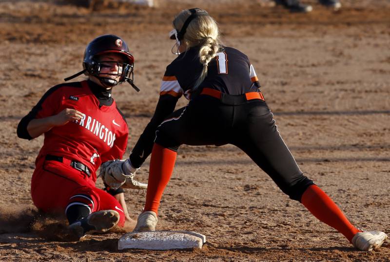 McHenry's Maddie Gillund tries to tag Barrington’s Amanda Glowack as she slides into second base during a non-conference softball game Friday, April 1, 2022, between McHenry and Barrington at Barrington High School.