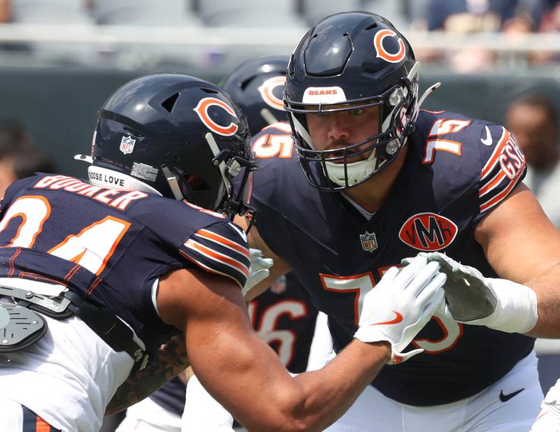 Chicago Bears offensive tackle Ozzy Trapilo (right) blocks defensive end Austin Booker during warmups Sunday, Aug. 10, 2025, before their preseason game against the Miami Dolphins at Soldier Field in Chicago.
