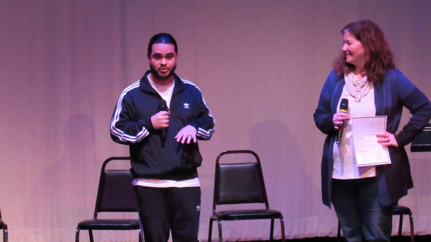 Joliet Uxmar Torres (left) and Lori Carmine (right), park manager at the Billie Limacher Bicentennial Park Theatre in Joliet, are seen onstage at Bicentennial Park's "Playwrights & Poets Fest" on Jan. 20. Torres is coordinating Bicentennial Park's first open mic night for poetry on April 5.
