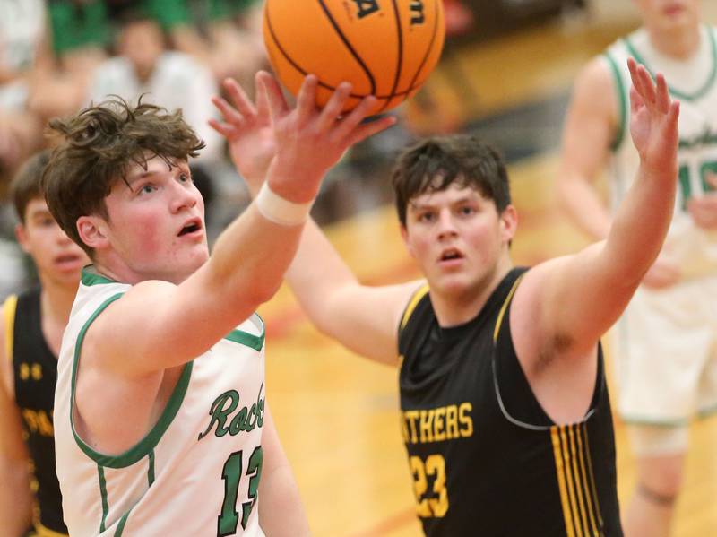 Rock Falls's Austin Castaneda eyes the hoop against Putnam County's AJ Furar during the 50th annual Colmone Classic on Monday, Dec. 9, 2024 at Hall High School.