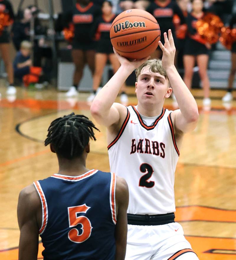 DeKalb’s Sean Reynolds shoots over Naperville North's Luke Williams during their game Friday, Dec. 8, 2023, at DeKalb High School.