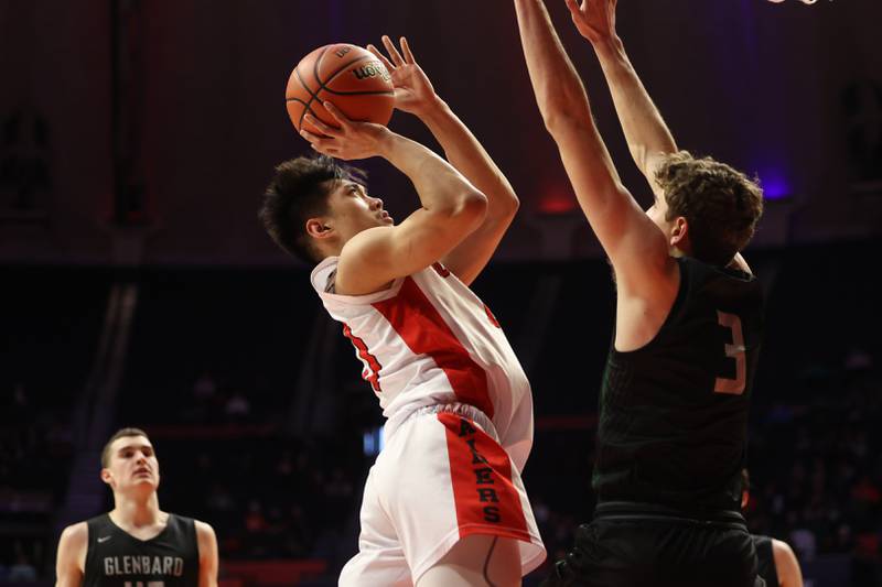 Bolingbrook’s MJ Langit puts up a shot against Glenbard West in the Class 4A semifinal at State Farm Center in Champaign. Friday, Mar. 11, 2022, in Champaign.
