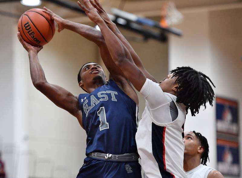 Oswego East's Andrew Wiggins (1) puts the ball up during a Hoops for Healing tournament game against West Aurora  on Nov. 20, 2023 at Naperville North High School in Naperville.