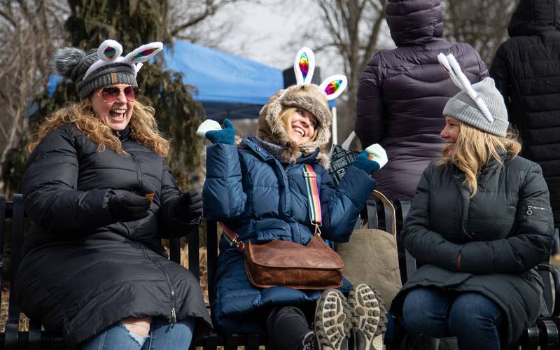 From left Helen Roehr, Joan Nehls and Tracy Nunziata laugh while checking their raffle tickets during the Elmhurst Park District's Adult Easter Egg Hunt at Wilder Park on Saturday, March. 18, 2023.