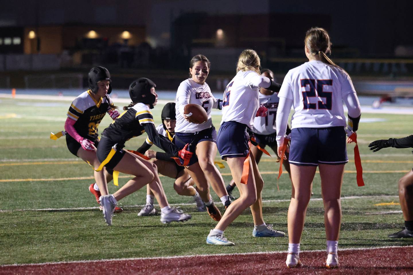 Oswego's Violette Wisniowicz looks to run the ball into the end zone as she's stopped short by Joliet West defenders during the Panthers' 13-7 victory over Joliet West on Tuesday, Oct. 7, 2025.