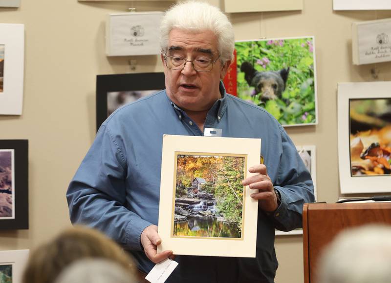Jim Rendant of Plano, holds his first place photo of a landscape during the Starved Rock Photography Show awards on Saturday, Jan. 3, 2026 at the Starved Rock Visitors Center.