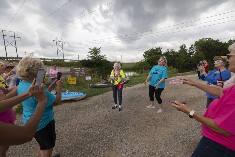 A rousing rendition of Happy Birthday is sung to Nancy Gates Wednesday, July 24, 2024 by the members of the Yak-Yak Sisters kayaking group to celebrate her 90th.