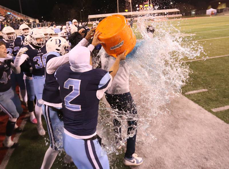 Members of the DePaul football team dump Gatorade on head coach Mike Passarella after winning the Class 4A State football championship on Friday, Nov. 29, 2024 at Hancock Stadium in Normal.
