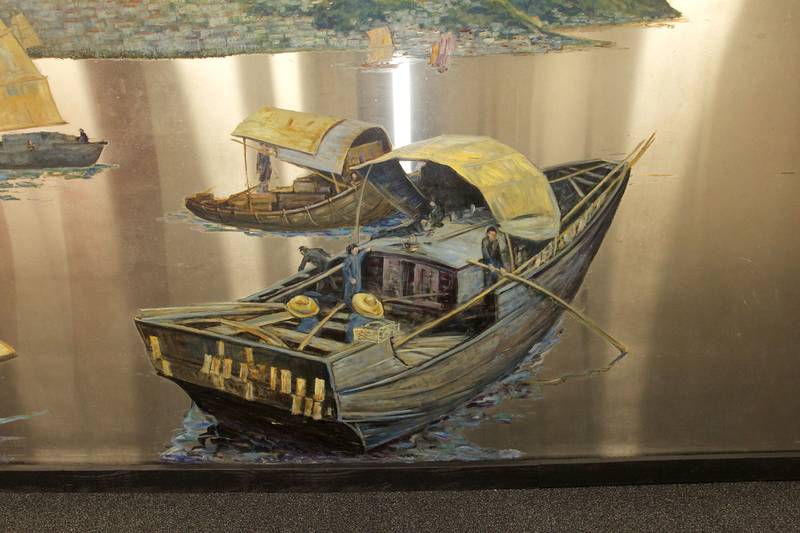 Candace H. Johnson for Shaw Local News Network
A detail in the Buell Mullen mural on display at the Lakefront Park building in Fox Lake. The mural titled, "Hong Kong," features a view of the Hong Kong harbor and is on loan from the National Museum of the American Sailor. The mural is approximately 20 ft. long and six-feet high on stainless steel and weighs about 600 pounds. This is one of a two pieces in a mural set with the other piece on display at the County Building in downtown Waukegan. (10/31/22)