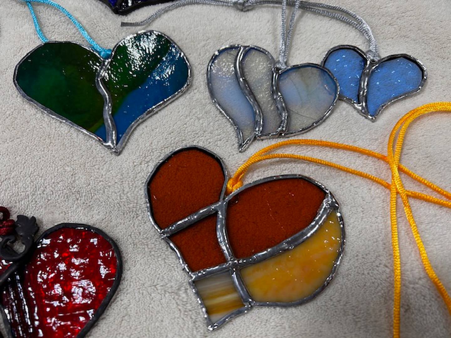 Stained glass art pieces created by artist Leslie Emrich