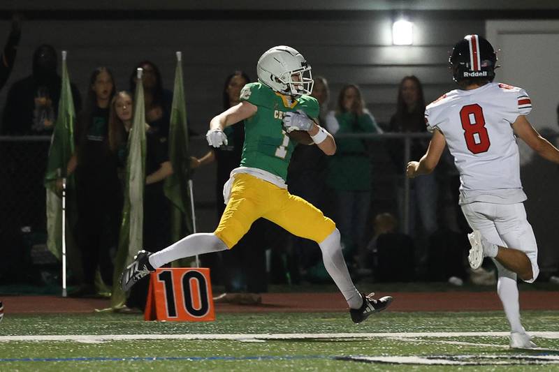 Providence’s Jayden Mikulski skirts the sidelines on a catch and run against Lincoln-Way Central on Friday, Sept. 6, 2024 in New Lenox.