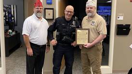 40&8 Blue Chevaliers give Morris Officer Evans a citation of appreciation