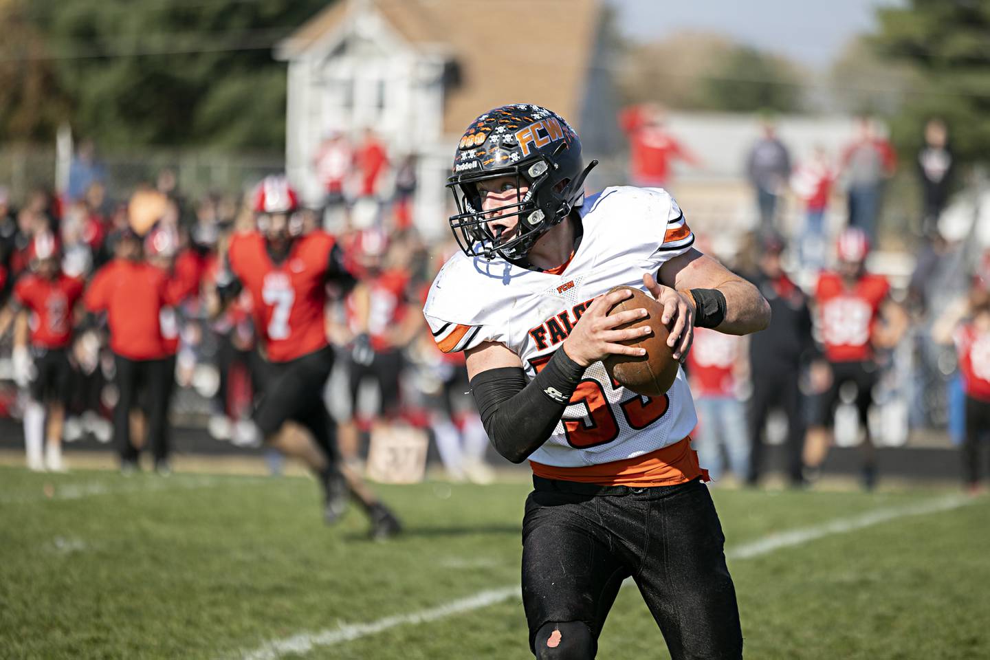 FCW’s Kelser Collins turns upfield after a catch against Amboy Saturday, Nov. 4, 2023 in the 8-man semifinal game in Amboy.