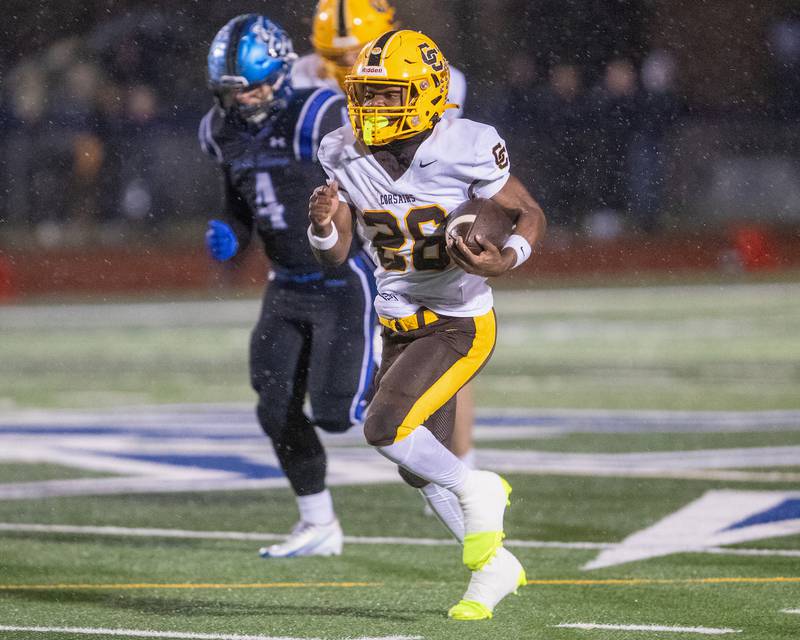 Carmel's Vinny Fiore runs the ball for a gain against St. Charles North at the Class 7A Second Round playoff game on Saturday, Nov.8,2025 in St. Charles.