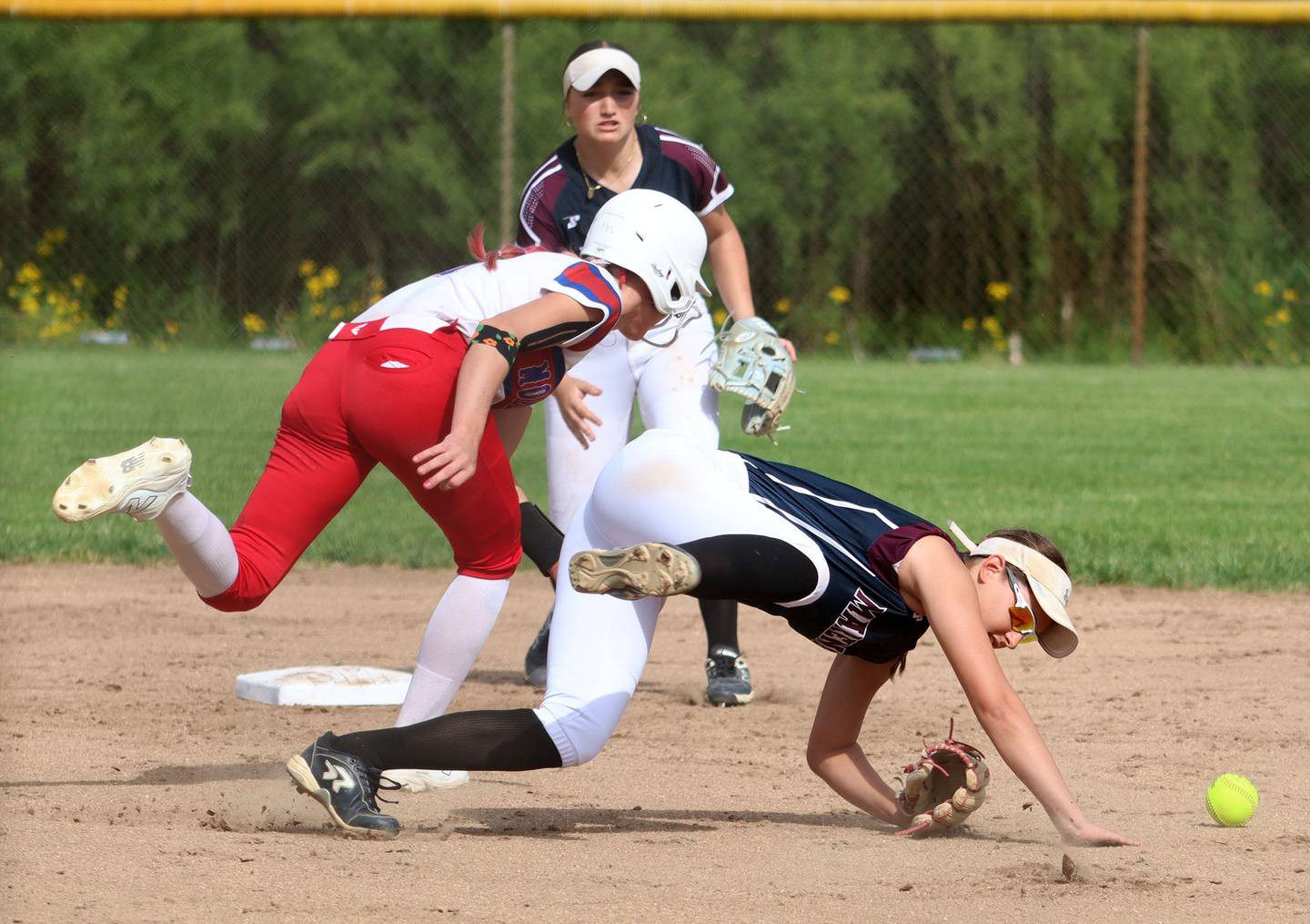 Morrison’s Bella Duncan, left, gets tangled up with  Marengo’s Gabrielle Gieseke in IHSA Class 2A Sectional Semifinal softball action at Marian Central High School in Woodstock on Thursday, May 29, 2025.
