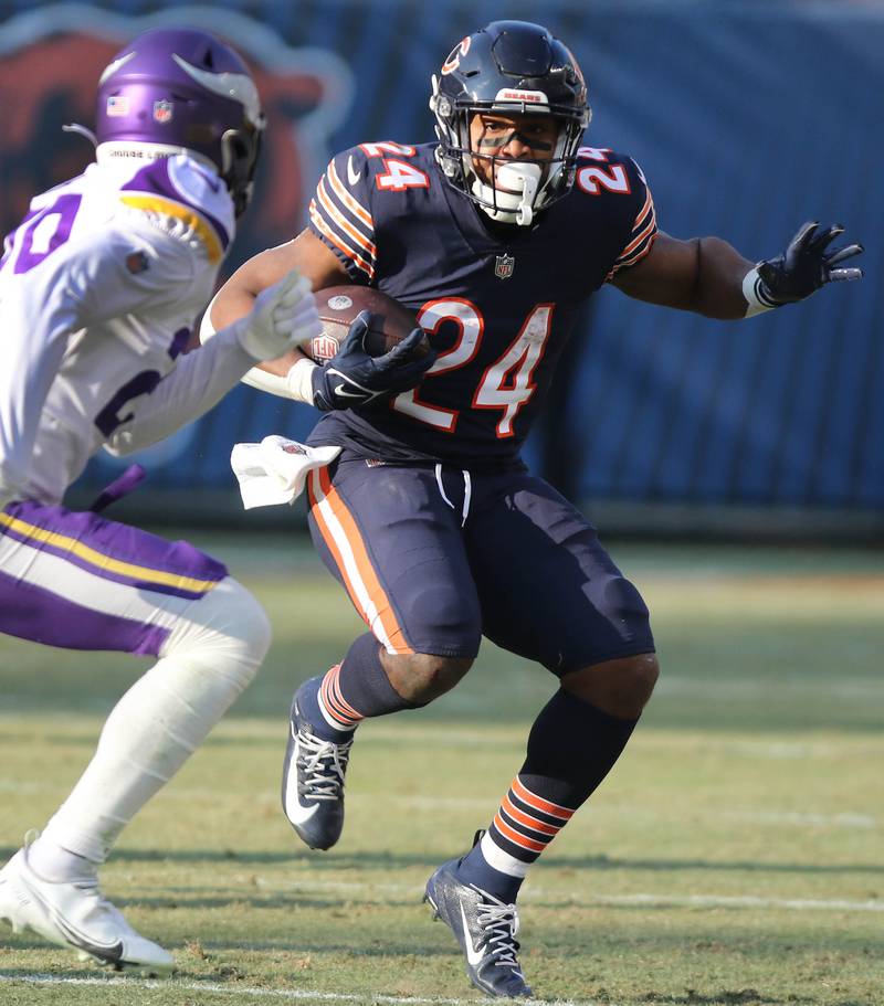 Chicago Bears running back Khalil Herbert gets outside of Minnesota Vikings cornerback Kris Boyd Sunday, Jan. 8, 2023, during their game at Soldier Field in Chicago.