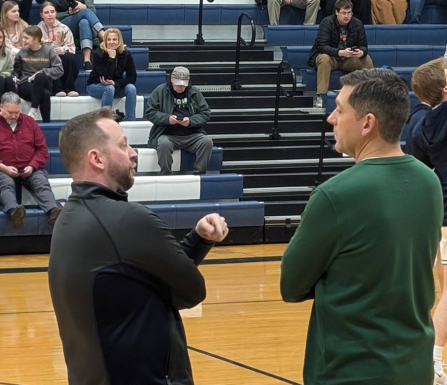 Coaches Adam McCloud (left) of Cary-Grove and Matt LePage of Crystal Lake South talk before their teams' game Friday, Jan. 10, 2025, at Cary-Grove High School in Cary.