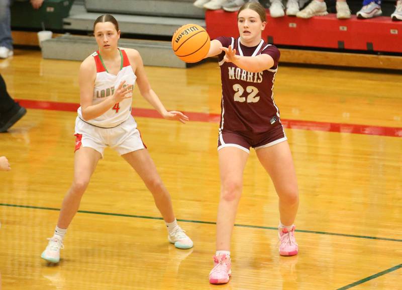 Morris's Layken Callahan passes the ball around L-P's Alexus Hines on Friday, Dec. 6, 2024 in Sellett Gymnasium at L-P High School.