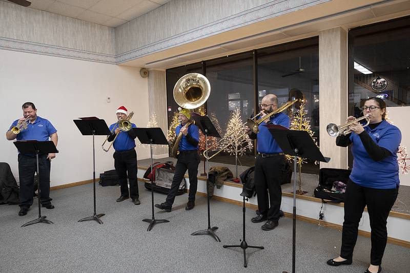 The Sterling Municipal Band belts out a Christmas tune Friday, Dec. 6, 2024, during Sterling’s Sights and Sounds Christmas event.