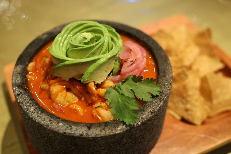 Aguachile Rojo, a popular coastal shrimp dish served with chips, topped with avocado is served during Casa Catrina’s soft opening on Thursday, Feb. 19, 2026 in Joliet.