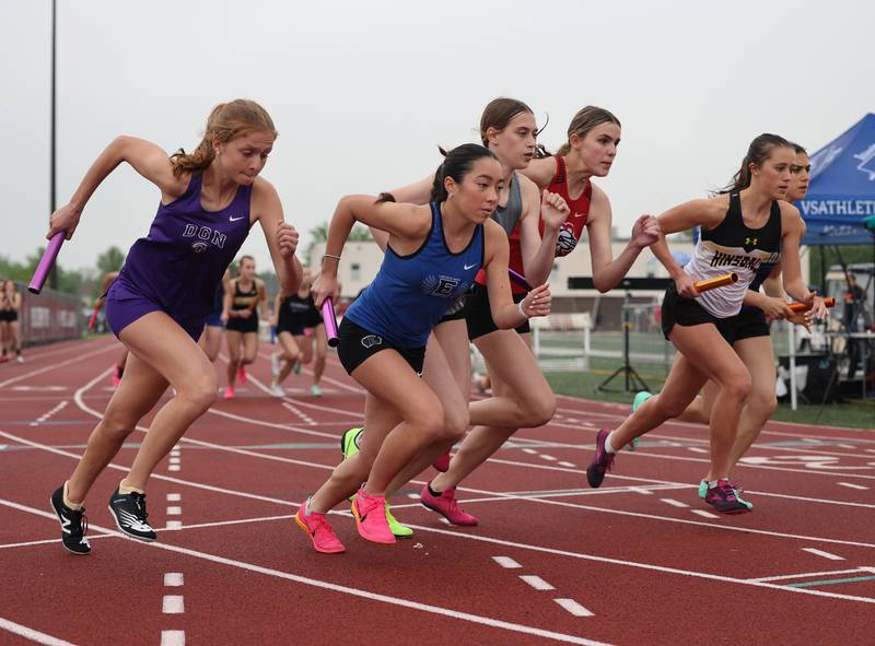 Participants start in the 4 X 800 relay during the girls varsity track and field 3A Lockport sectional on Friday, May 12, 2023.