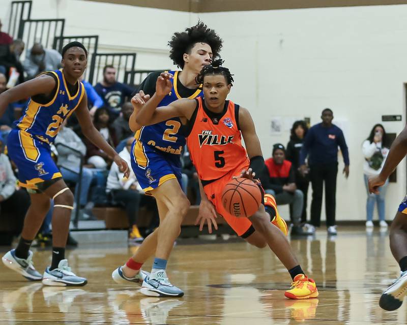 Romeoville's Ej Mosley Jr (5) drives down the lane in the WJOL Tournament Championship game. Nov 25, 2023.