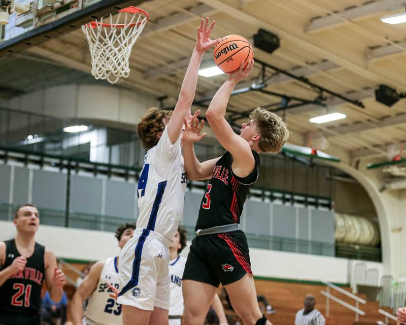 Yorkville's Frankie Pavlik (3) attempts a shot over St Francis Ben Whorlow (44) during their Jack Tosh Holiday Classic basketball tournament game between St Francis at Yorkville Thursday Dec 26, 2024 in Elmhurst.