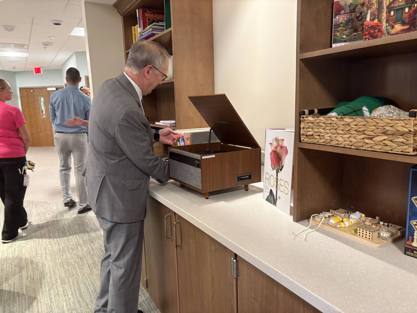 McHenry County Board member Joe Gottemoller looks at records in the living room of the Valley Hi memory care wing  June 23, 2025.