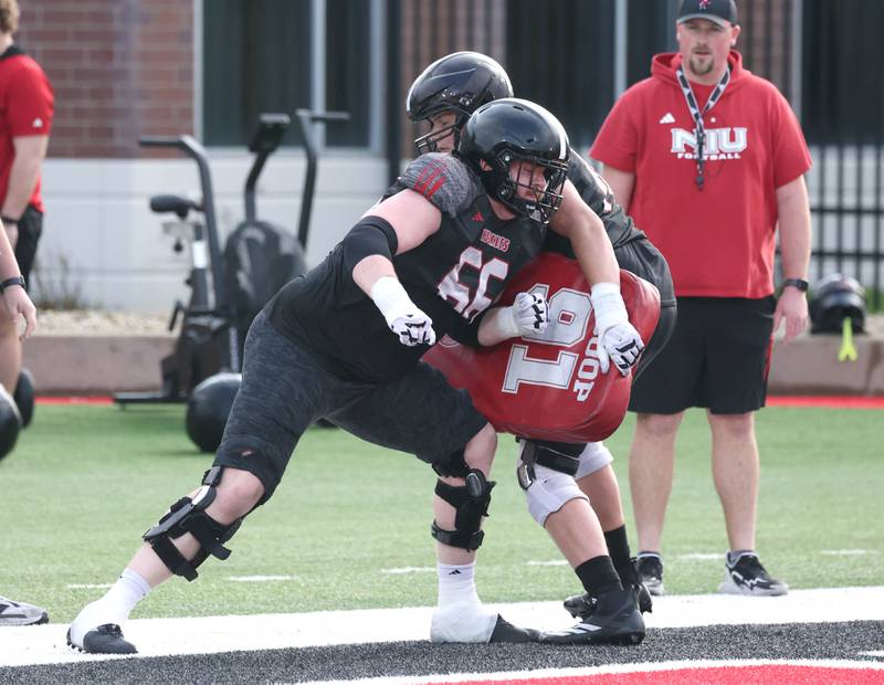 Northern Illinois University offensive lineman Lane Mahnesmith throws a block Tuesday, April 14, 2026, during a drill at spring practice in Huskie Stadium at NIU in DeKalb.