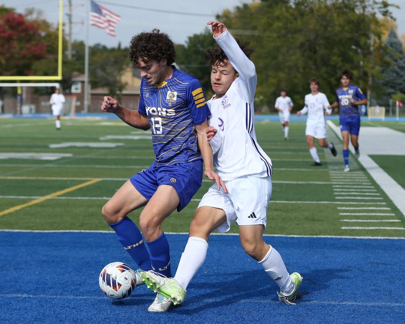 Lyon's Harrison Hoekstra (13) battles Downers Grove North's Ty Peboontom (9) during Class 3A Lyons Regional final soccer match.  Oct 21, 2023.