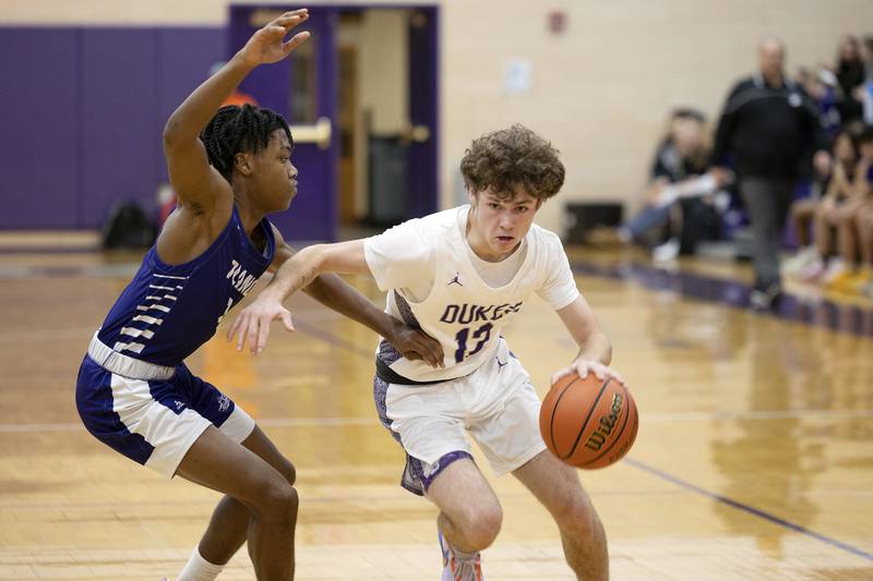 Dixon’s Jath St.Pier works against Plano’s Davione Stamps Tuesday, Dec. 13, 2022.