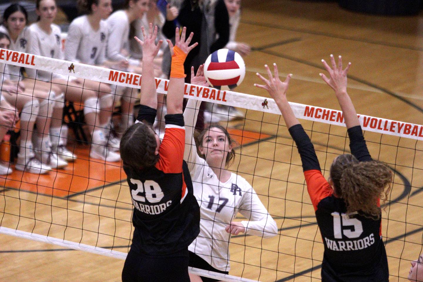 Prairie Ridge’s Mackenzie Schmidt sends the ball over the net in varsity girls volleyball at McHenry Thursday.