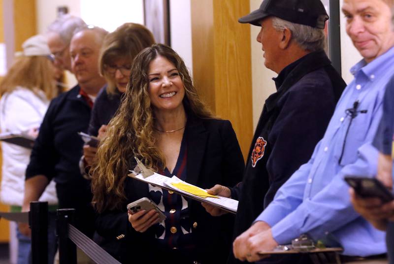 Diana Hartmann, the McHenry County Regional superintendent of schools, waits in line at the McHenry County clerk's office in Woodstock on Monday, Oct. 27, 2025, to file her candidate forms to run for reelection in the 2026 spring primary.