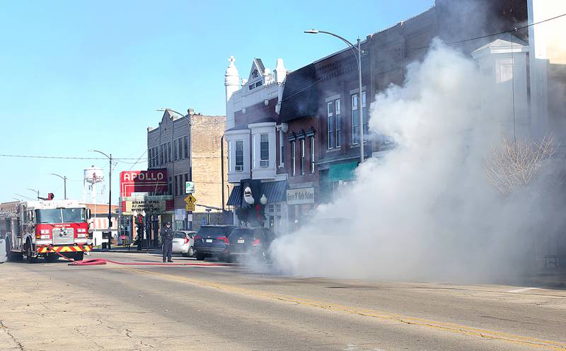 Princeton firefighters work the scene of a vehicle fire in the 500 block of South Main Street on Monday, Nov. 21, 2022 in Princeton. The fire began around 10:45a.m.