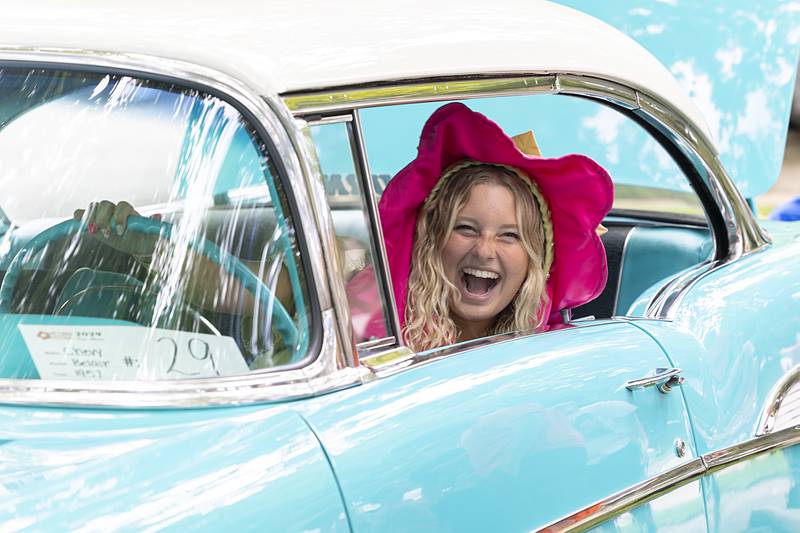 Pinky Petunia, aka Emma Olson, smiles from the driver’s seat of Don Schrock’s ’57 Chevy Friday, July 5, 2024.