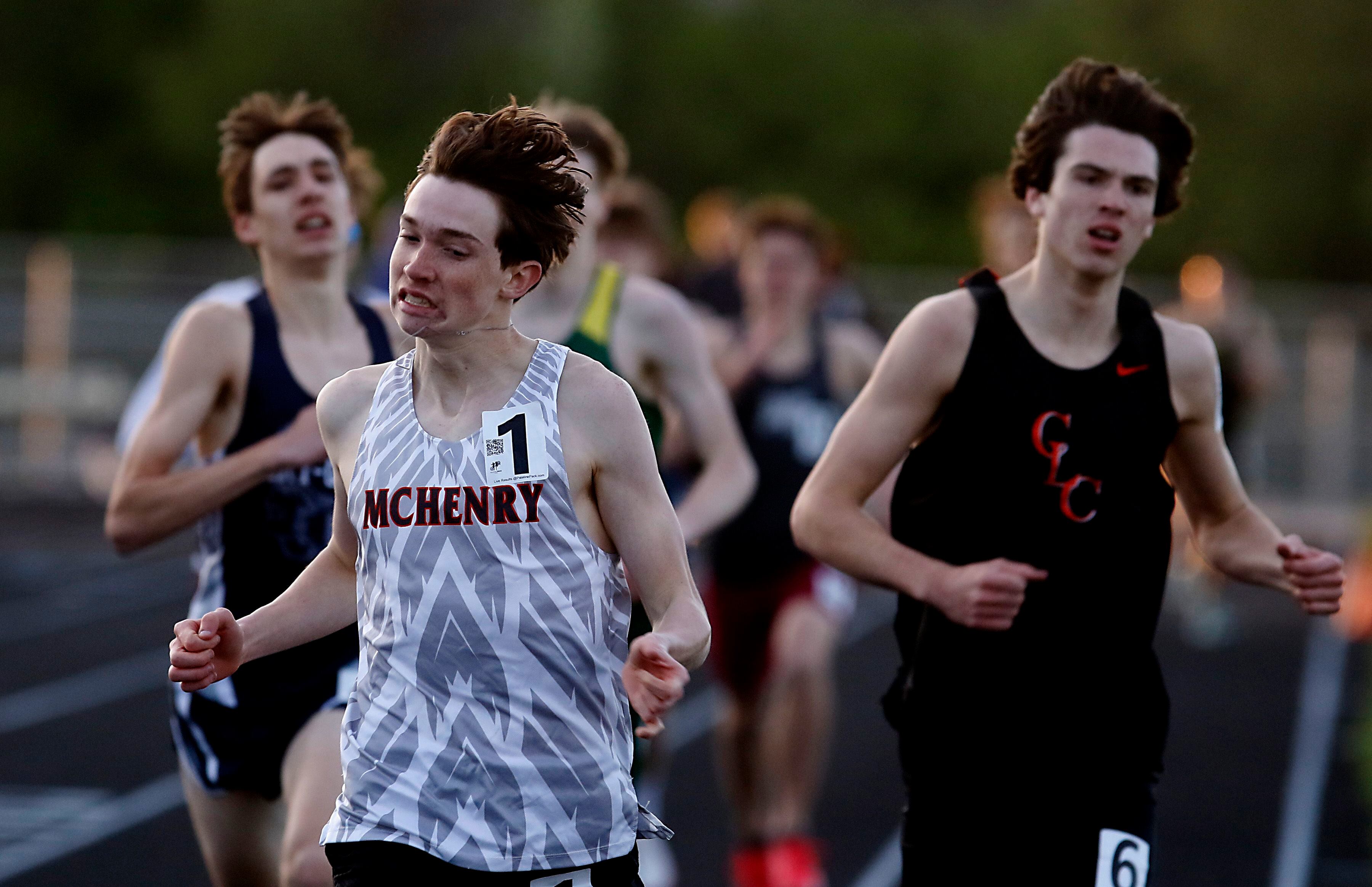 McHenry’s Doug Martin edges out Cary-Grove’s Jameson Tenopir (left) and Crystal Lake Central’s Jackson Hopkins (right) to win the 800 meter run on Friday, April 19, 2024, during the McHenry County Track and Field Meet at Cary-Grove High School.