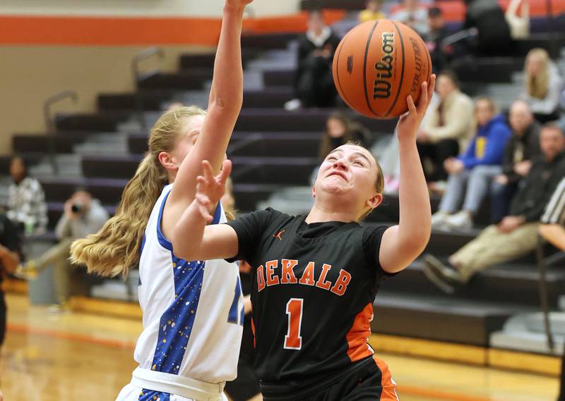 DeKalb’s Ella Russell shoots over Wheaton North's Anna Leicht during their Class 4A regional game Monday, Feb 12, 2024, at DeKalb High School.