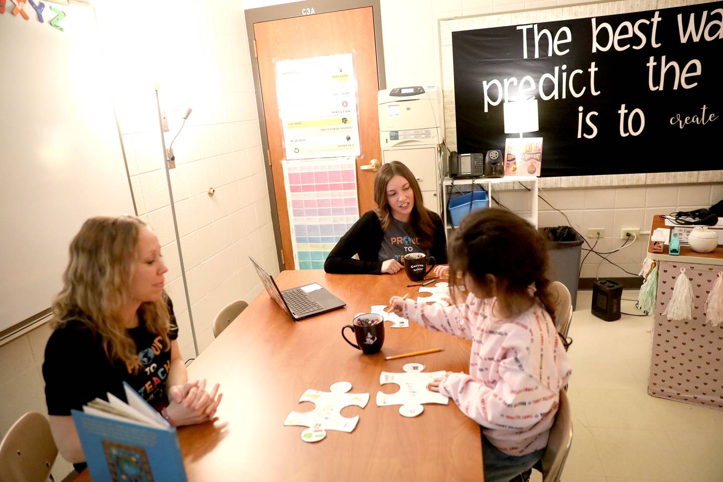 Abby Ortega (left) and Amanda Clabough (right, center) are English Language Learner teachers at St. Charles School District 303. They support students whose native language is not English. The students that they serve at Corron speak 26 different languages.