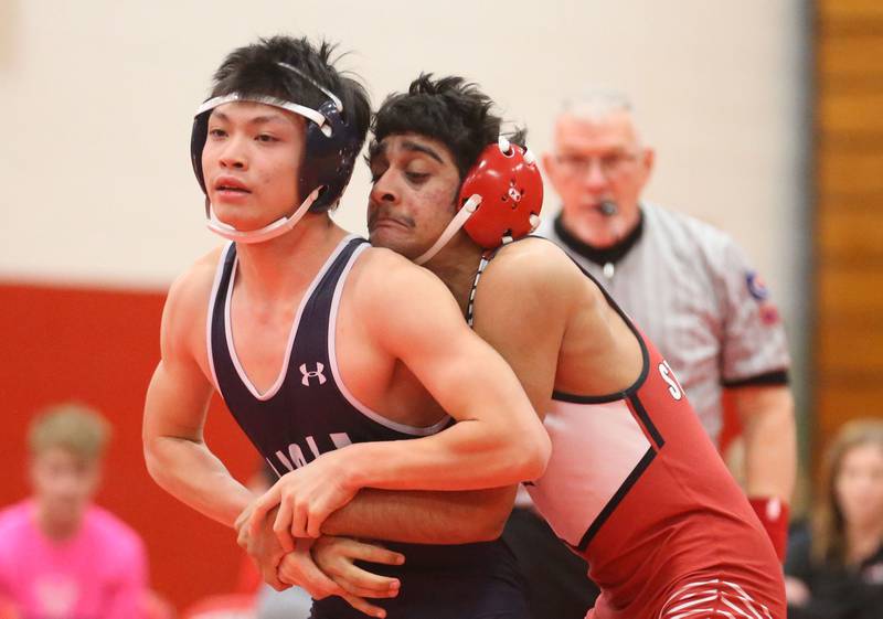 Streator's Ved Chaudhari (at right) maintains control of Lisle's Charles Wang during a meet Wednesday, Jan. 21, 2026, in Streator's Pops Dale Gymnasium.