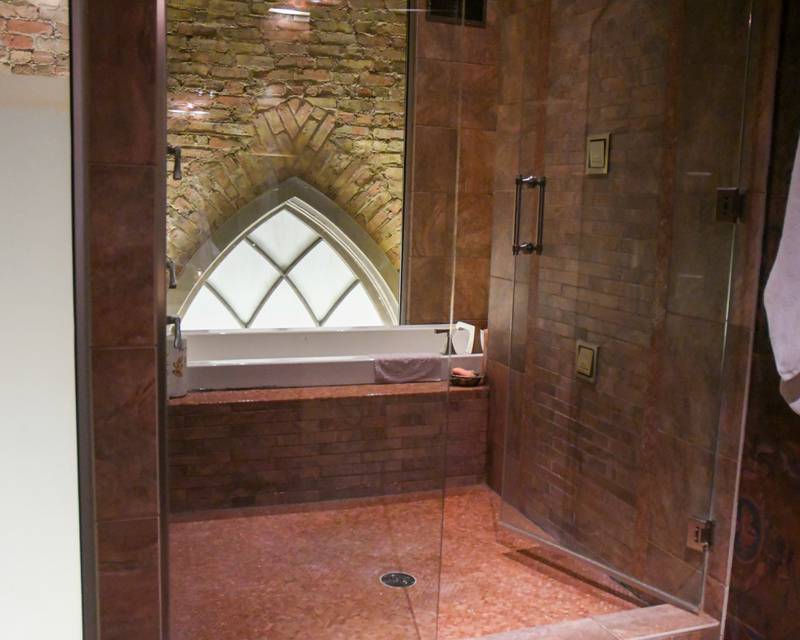 The shower and bath shown at the Padgett Home on North Kesington is one of the many unique items in the home that community members got to view during the Holiday Sip and Sweet Tour in La Grange on Sunday Dec. 17, 2023.