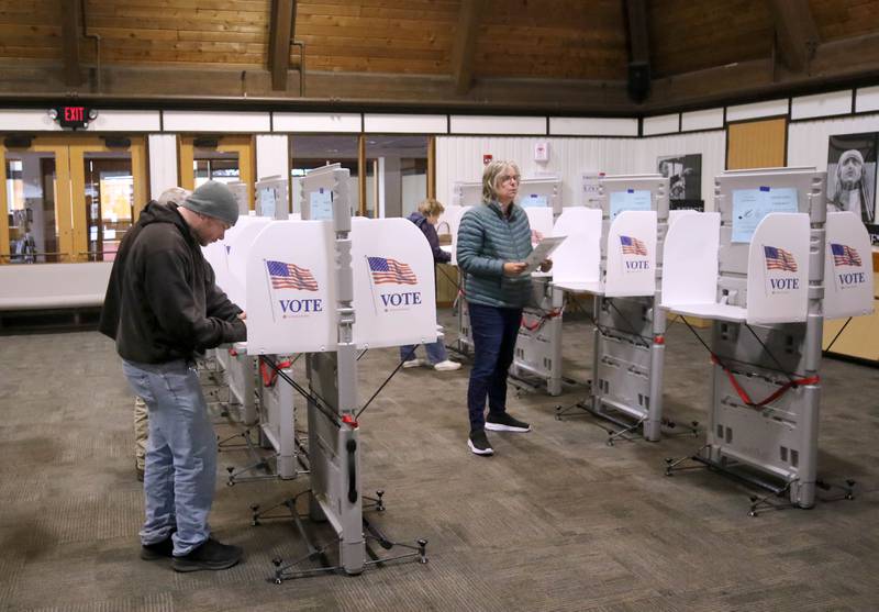 Voters cast their ballot in the primary election Tuesday, March 19, 2024, in the polling place at Westminster Presbyterian Church in DeKalb.