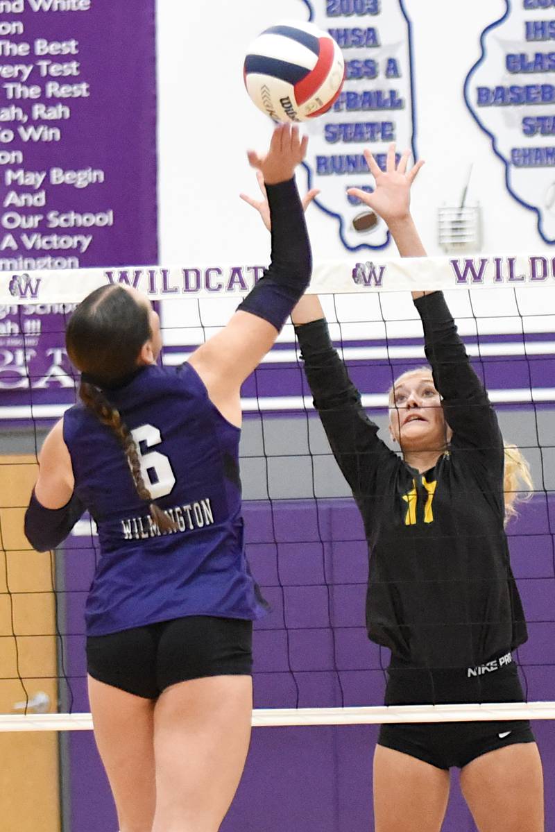 Coal City's Margaret Carlson, right, looks to block a hit from Wilmington's Ally Allgood during a game at Wilmington Thursday, Sept. 25, 2025.