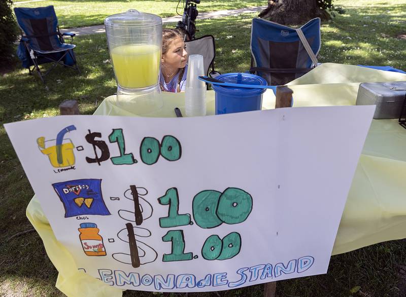 Vida Rubio, 11, of Dixon sets up shop Monday, June 23, 2025, at John Dixon Park. The young entrepreneur was looking to earn spending money for a planned trip to a cousin’s quinceanera in Mexico.