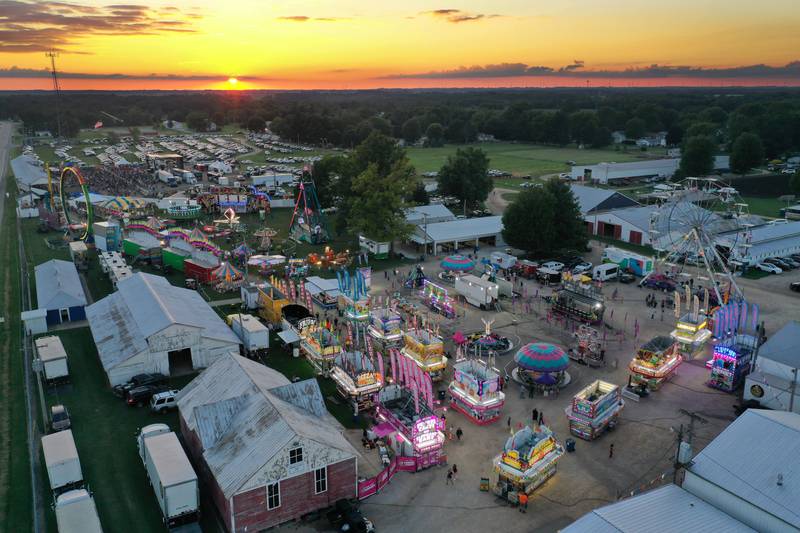 The sun sets over the Bureau county Fair on Thursday, Aug. 21, 2025 in Princeton.